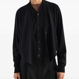 Black top worn by a person, showing the top fit