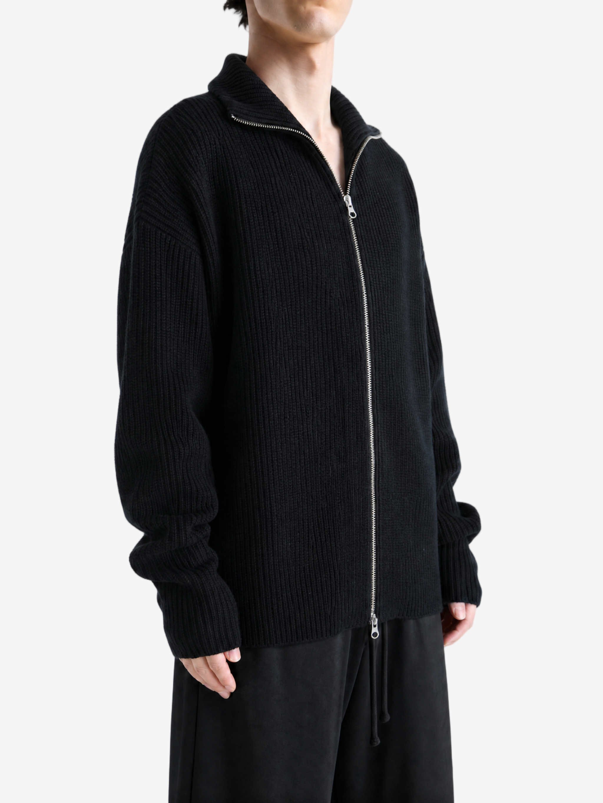 Black hoodie worn by a person, showing the hoodie fit