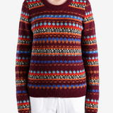 Burgundy hoodie worn by a person, showing the hoodie fit