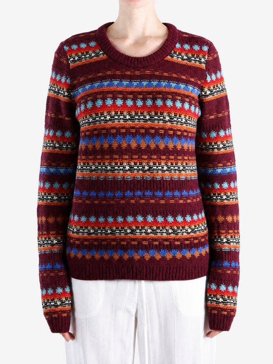 Burgundy hoodie worn by a person, showing the hoodie fit