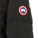 Close up of Black jacket, showing texture of the 84% recycled polyester/ 16% organic cotton made fabric