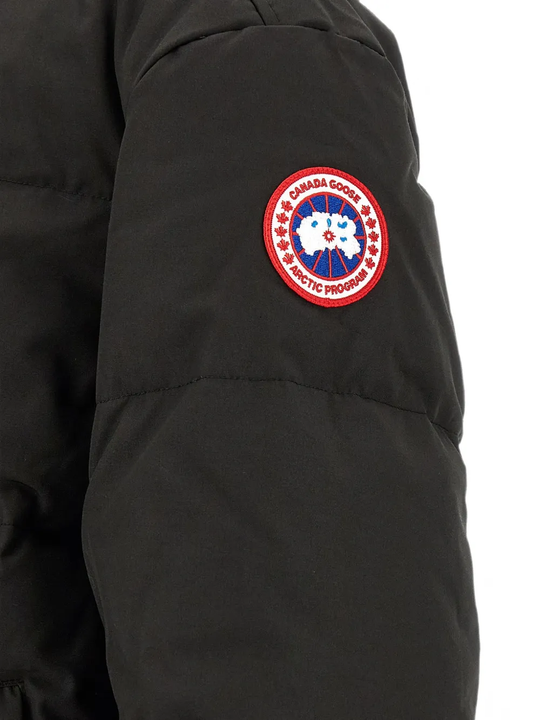 Close up of Black jacket, showing texture of the 84% recycled polyester/ 16% organic cotton made fabric