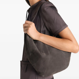 Brown bag worn by a person, showing the bag fit