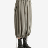 Tan pants worn by a person, showing the pants fit