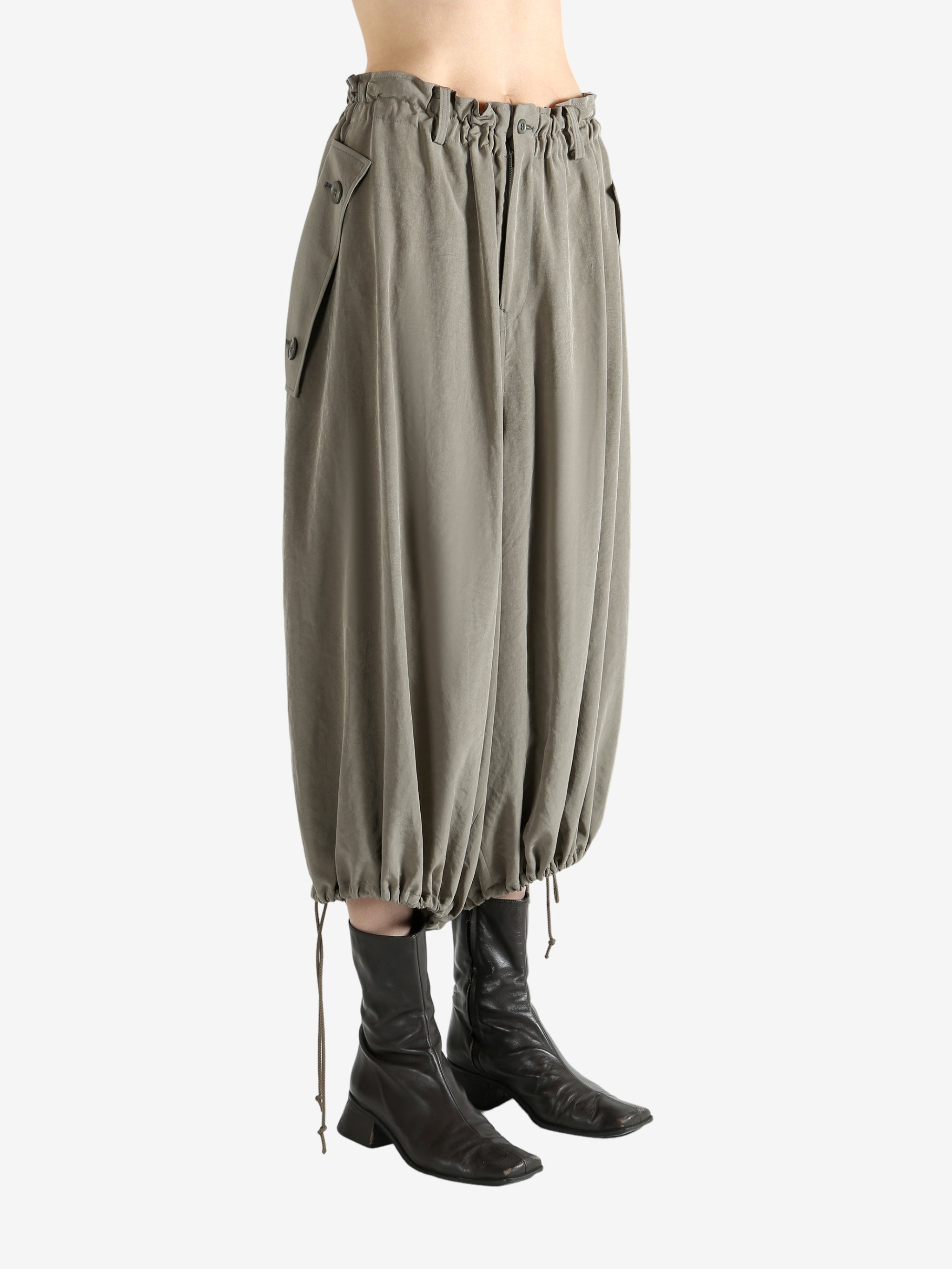 Tan pants worn by a person, showing the pants fit