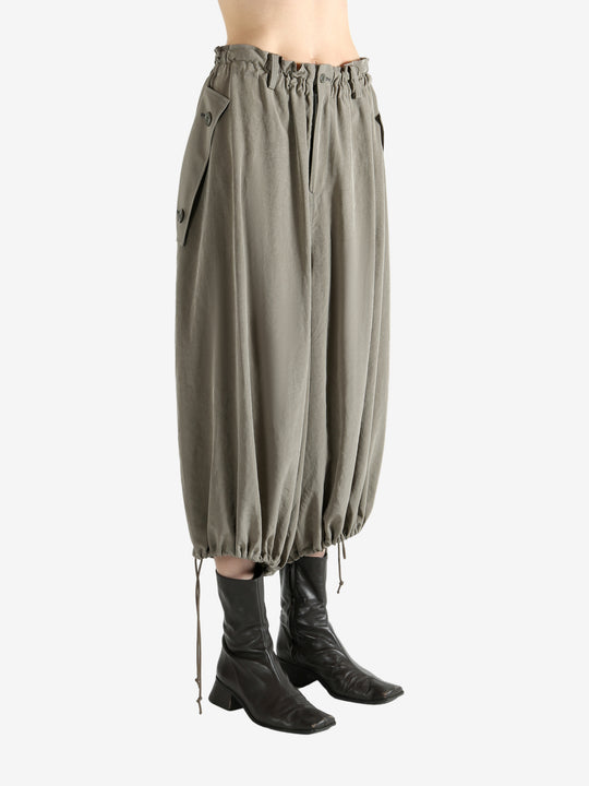 Tan pants worn by a person, showing the pants fit