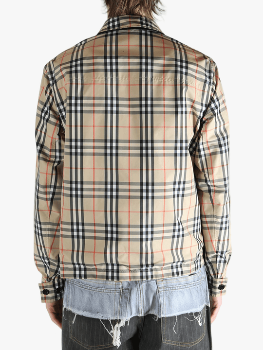 Yellow  jacket worn by a person, showing the  jacket's fit