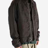 Brown jacket worn by a person, showing the jacket's fit