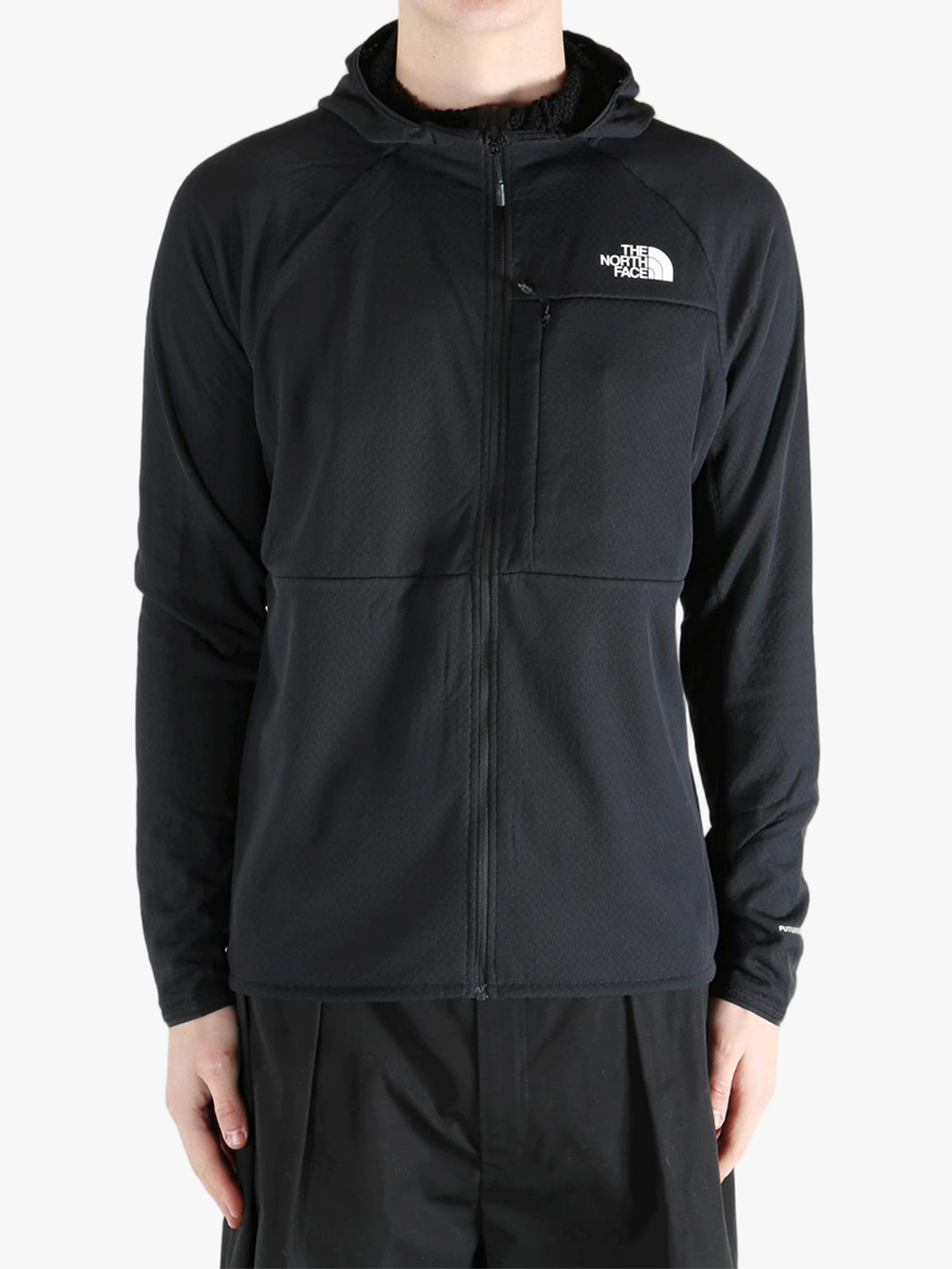 Black hoodie worn by a person, showing the hoodie's fit