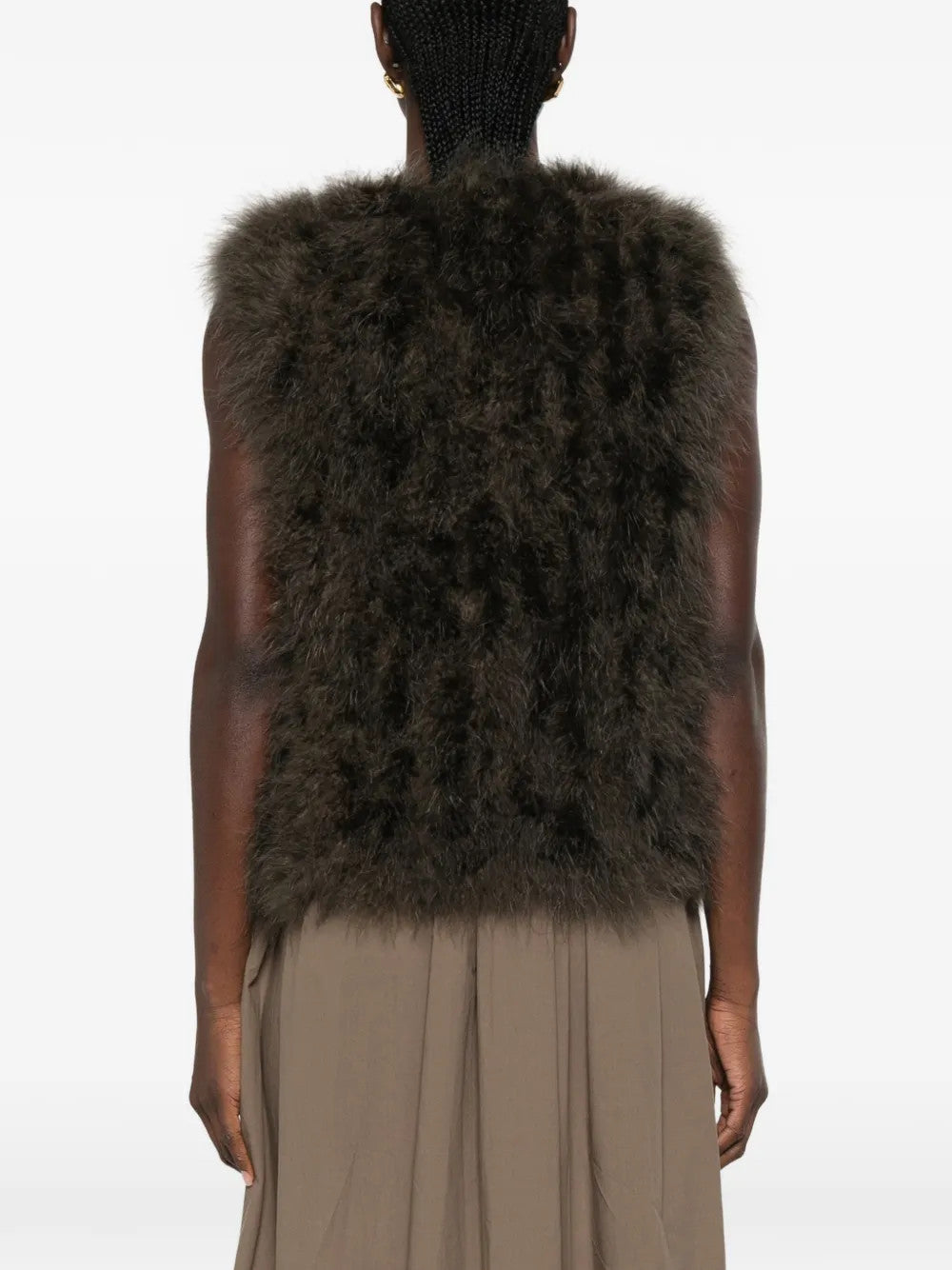 Brown jacket worn by a person, showing the jacket fit