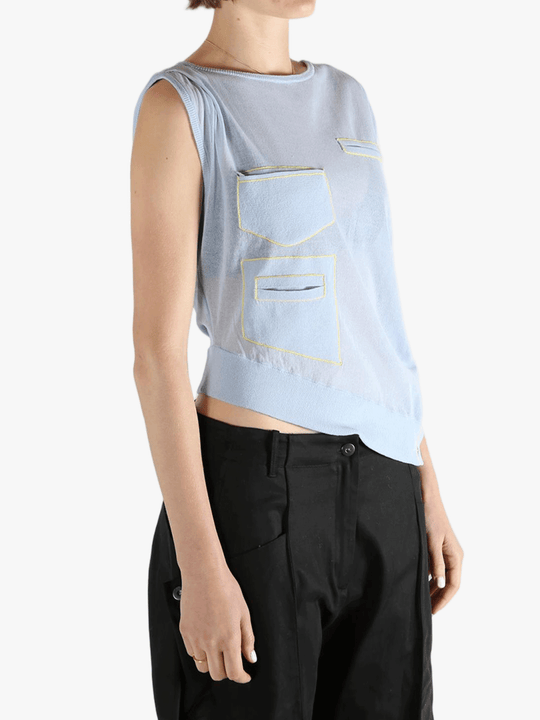 Blue vest worn by a person, showing the loose fit.