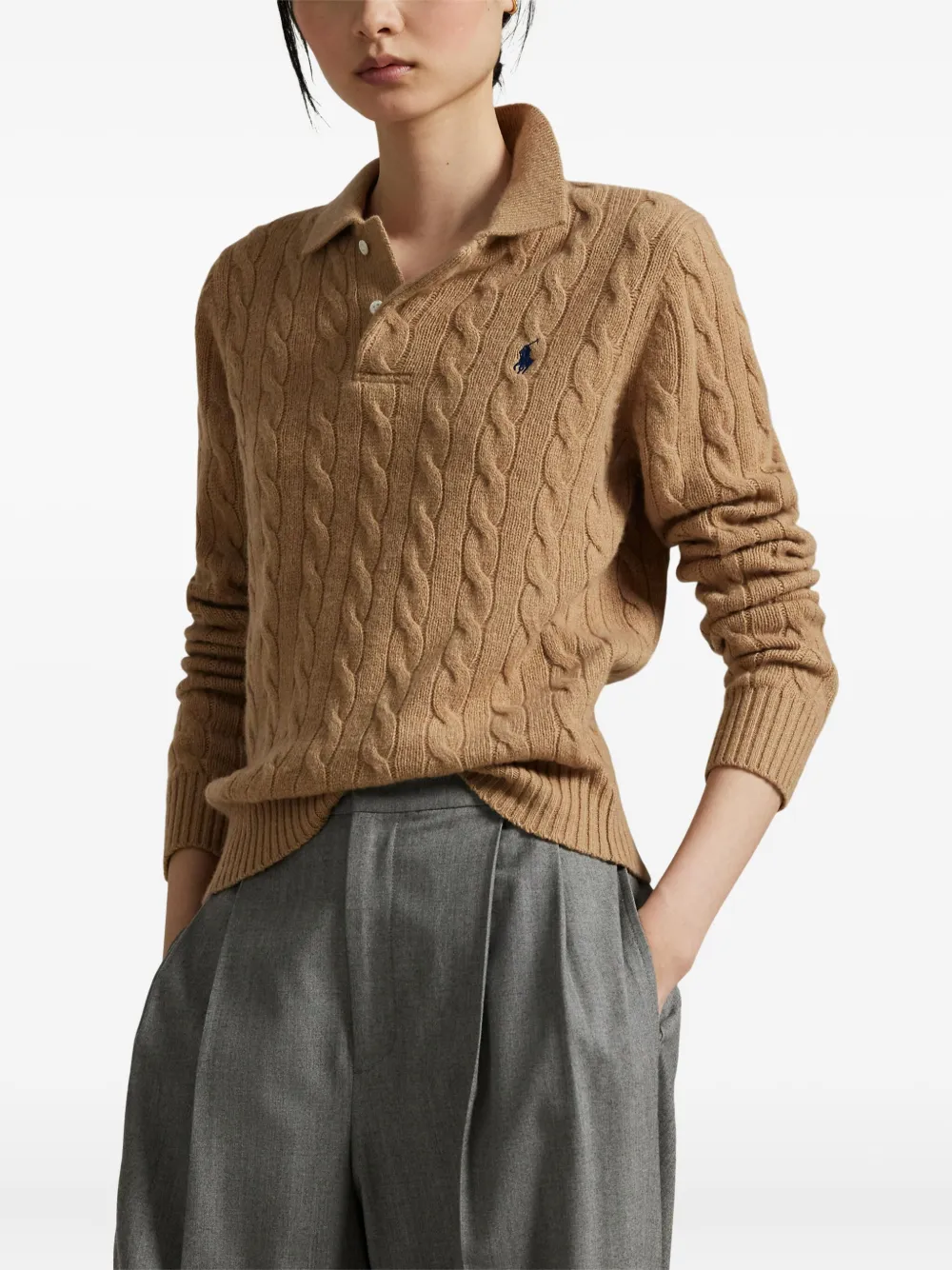 Brown knitwear worn by a person, showing the knitwear fit