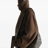 Brown bag worn by a person, showing the bag fit