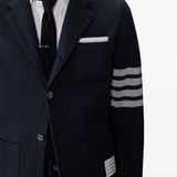 Close up of navy jacket, showing texture of the Virgin wool fabric