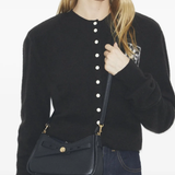 black bag worn by a person, showing the bag fit