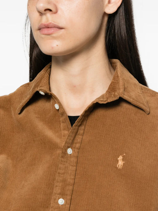 Brown shirt worn by a person, showing the shirt fit