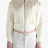 White jackets worn by a person, showing the jackets fit