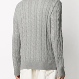 Grey sweater worn by a person, showing the sweater fit