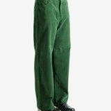 Green pants worn by a person, showing the pants's fit