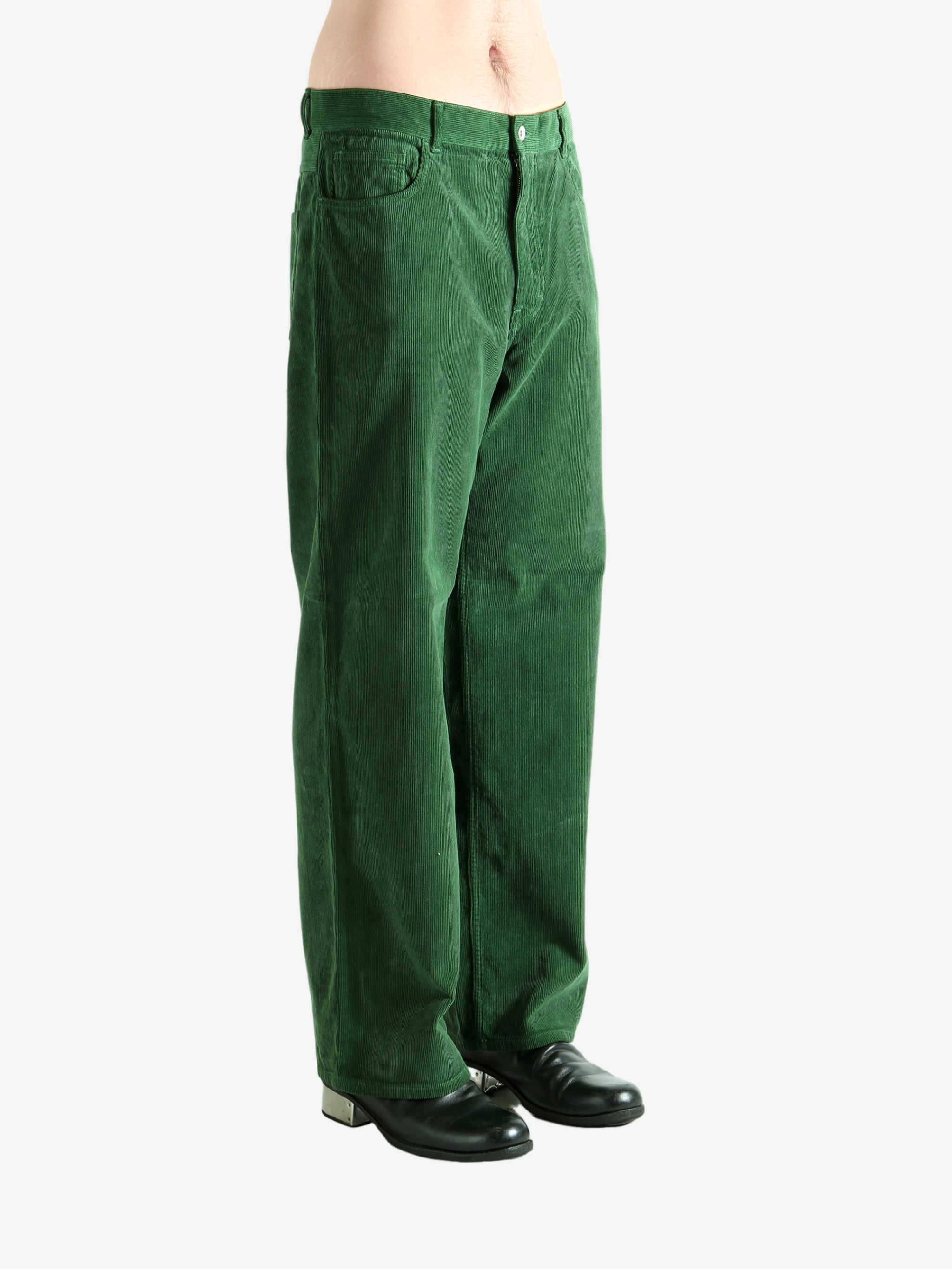 Green pants worn by a person, showing the pants's fit