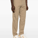 Tan pants worn by a person, showing the pants‘ fit
