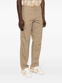 Tan pants worn by a person, showing the pants‘ fit