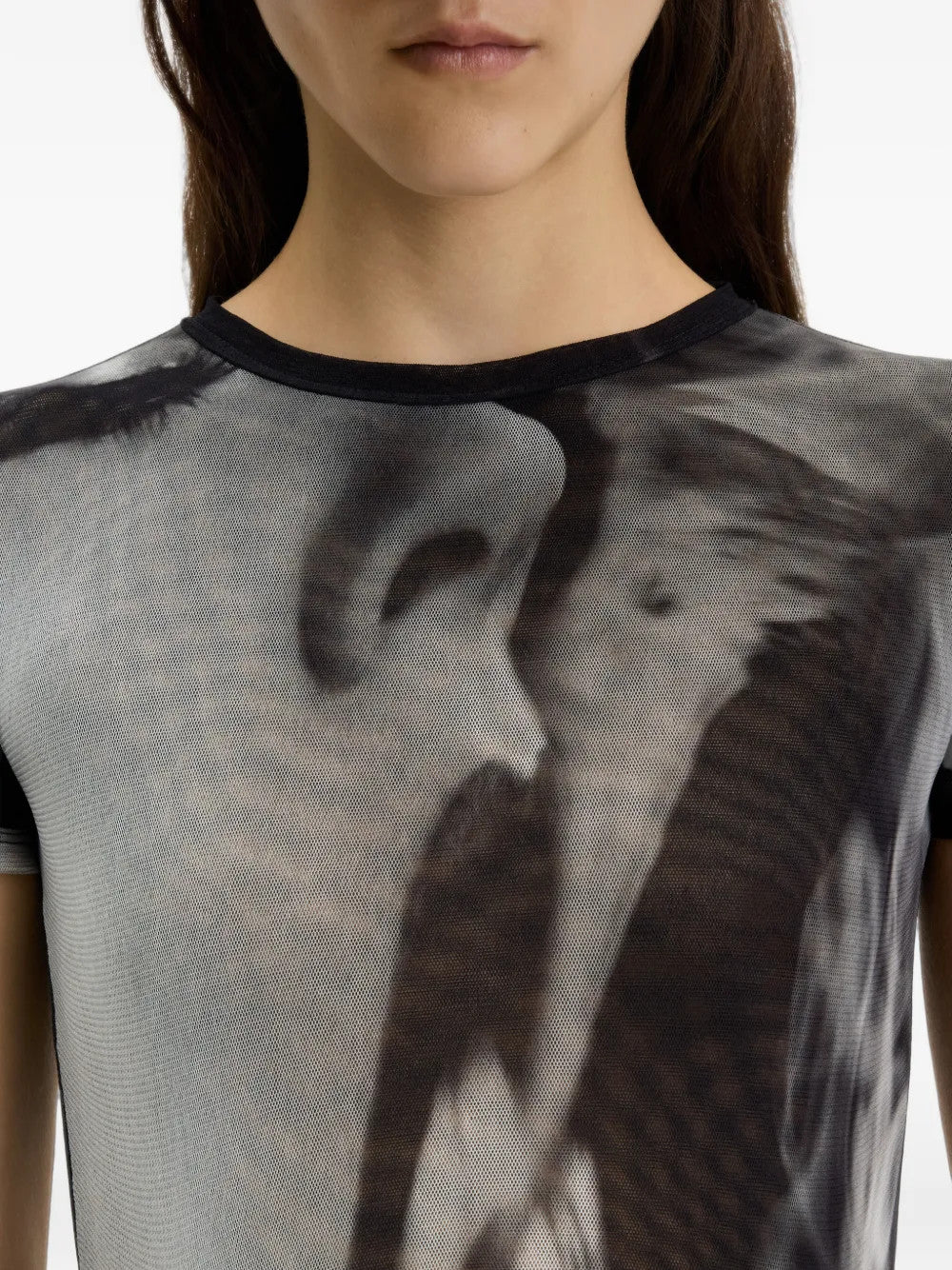 Black t-shirt worn by a person, showing the t-shirt fit