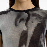 Black t-shirt worn by a person, showing the t-shirt fit