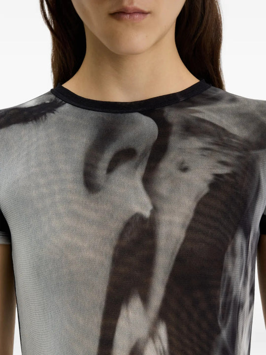 Black t-shirt worn by a person, showing the t-shirt fit