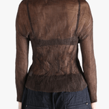 Brown shirt worn by a person, showing the shirt fit