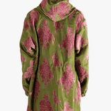 green jackets-coats worn by a person, showing the jackets-coats fit