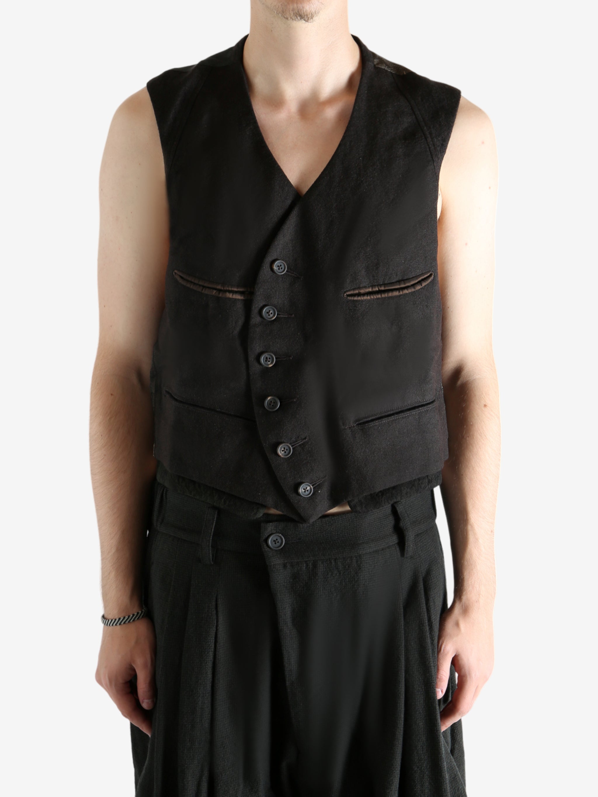 Grey vest worn by a person, showing the vest's fit