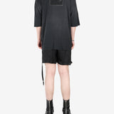 Black t-shirt, worn by a person, showing the t-shirt's fit