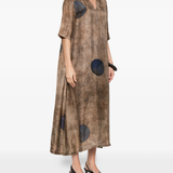 Brown dress worn by a person, showing the dress's fit