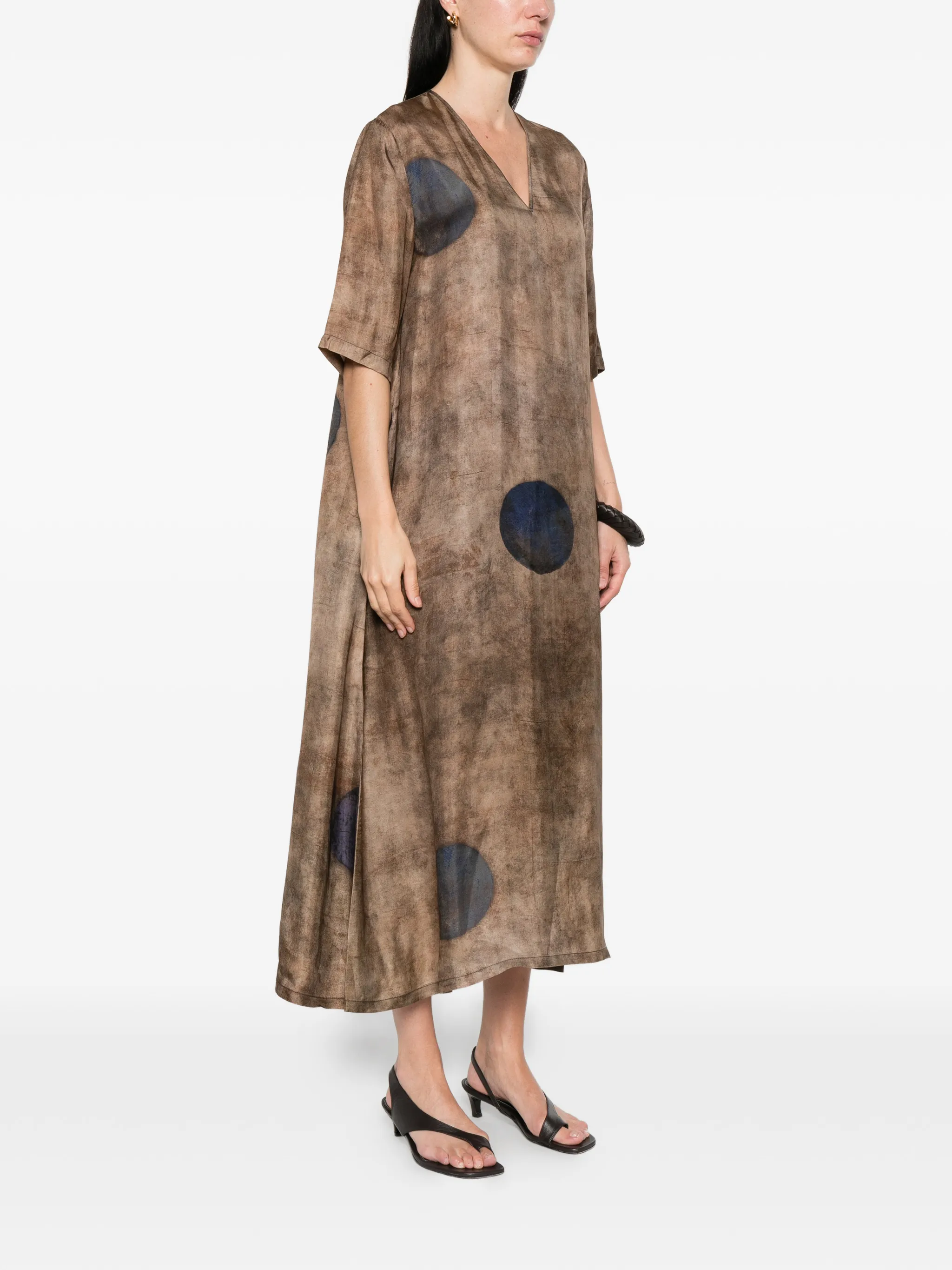 Brown dress worn by a person, showing the dress's fit
