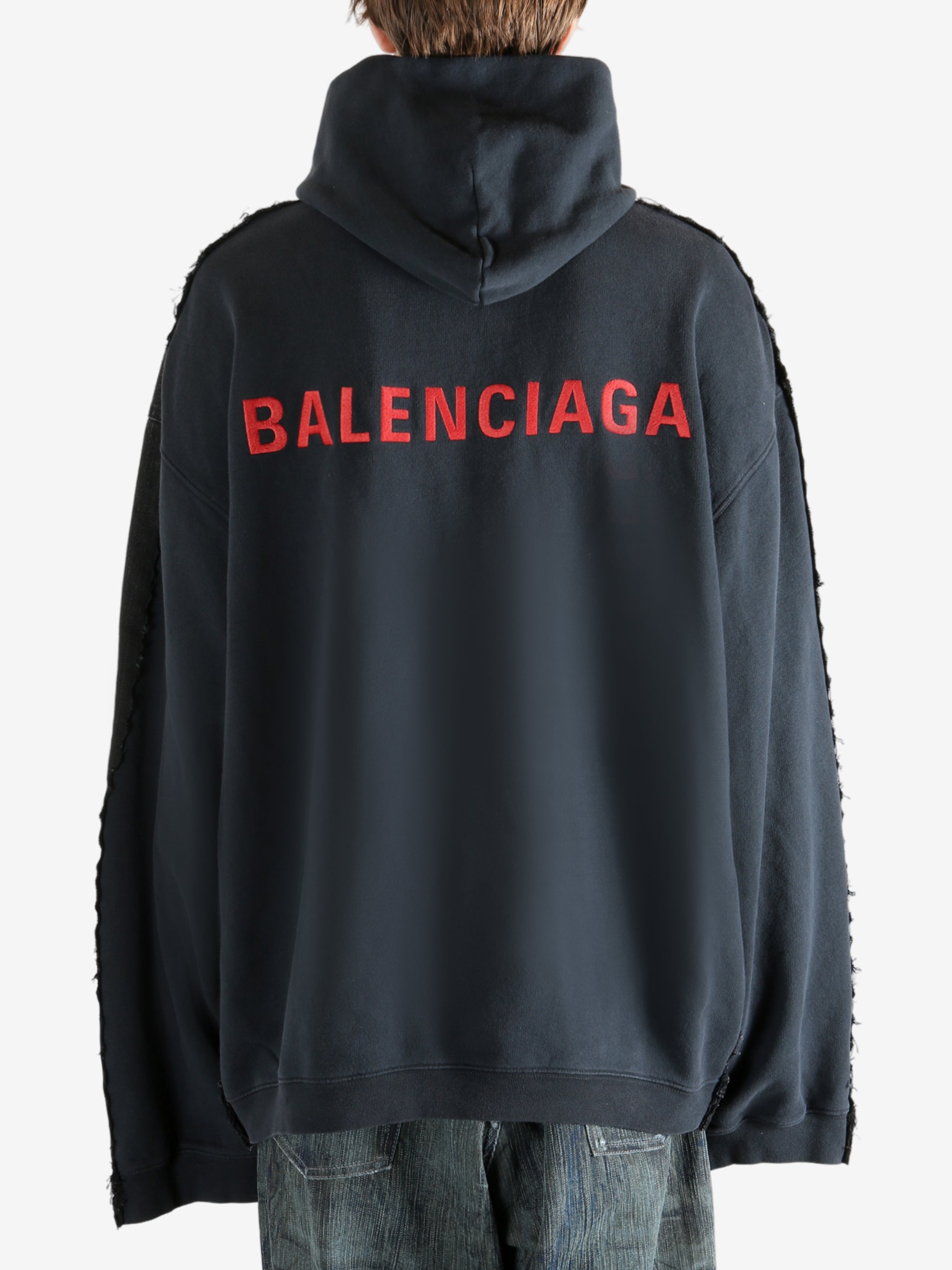 Black jacket worn by a person, showing the jacket fit