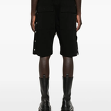 Black shorts worn by a person, showing the shorts fit