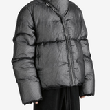 Black jacket worn by a person, showing the jacket fit