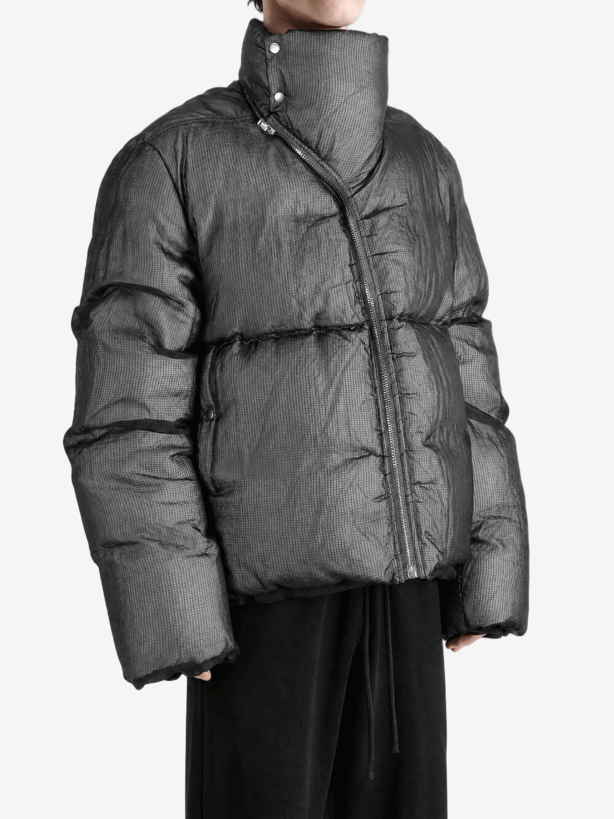 Black jacket worn by a person, showing the jacket fit