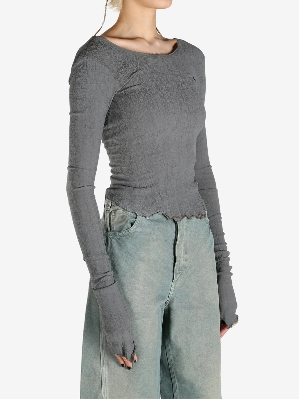 Grey tops worn by a person, showing the tops fit