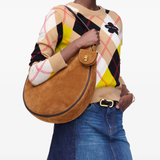 Yellow bag worn by a person, showing the bag's fit