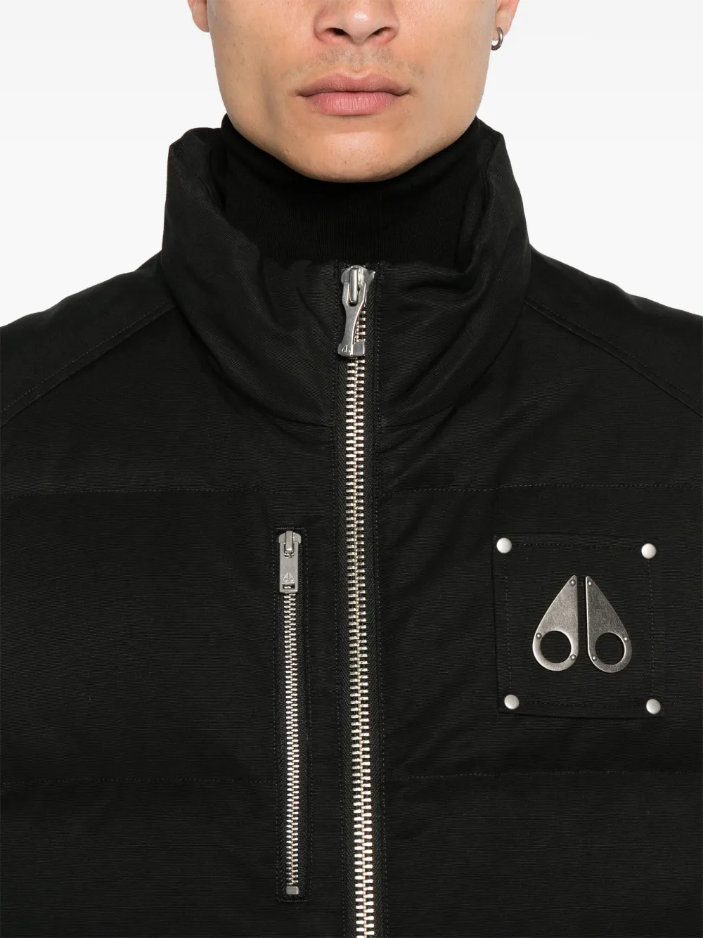 Black jacket worn by a person, showing the jacket fit