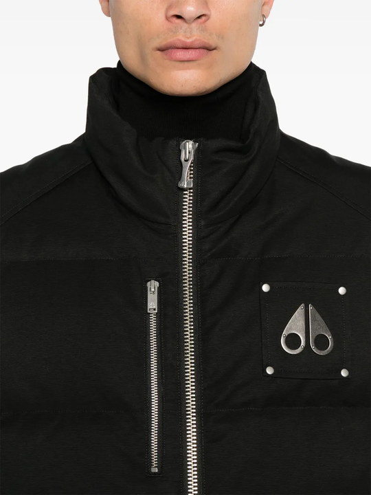 Black jacket worn by a person, showing the jacket fit
