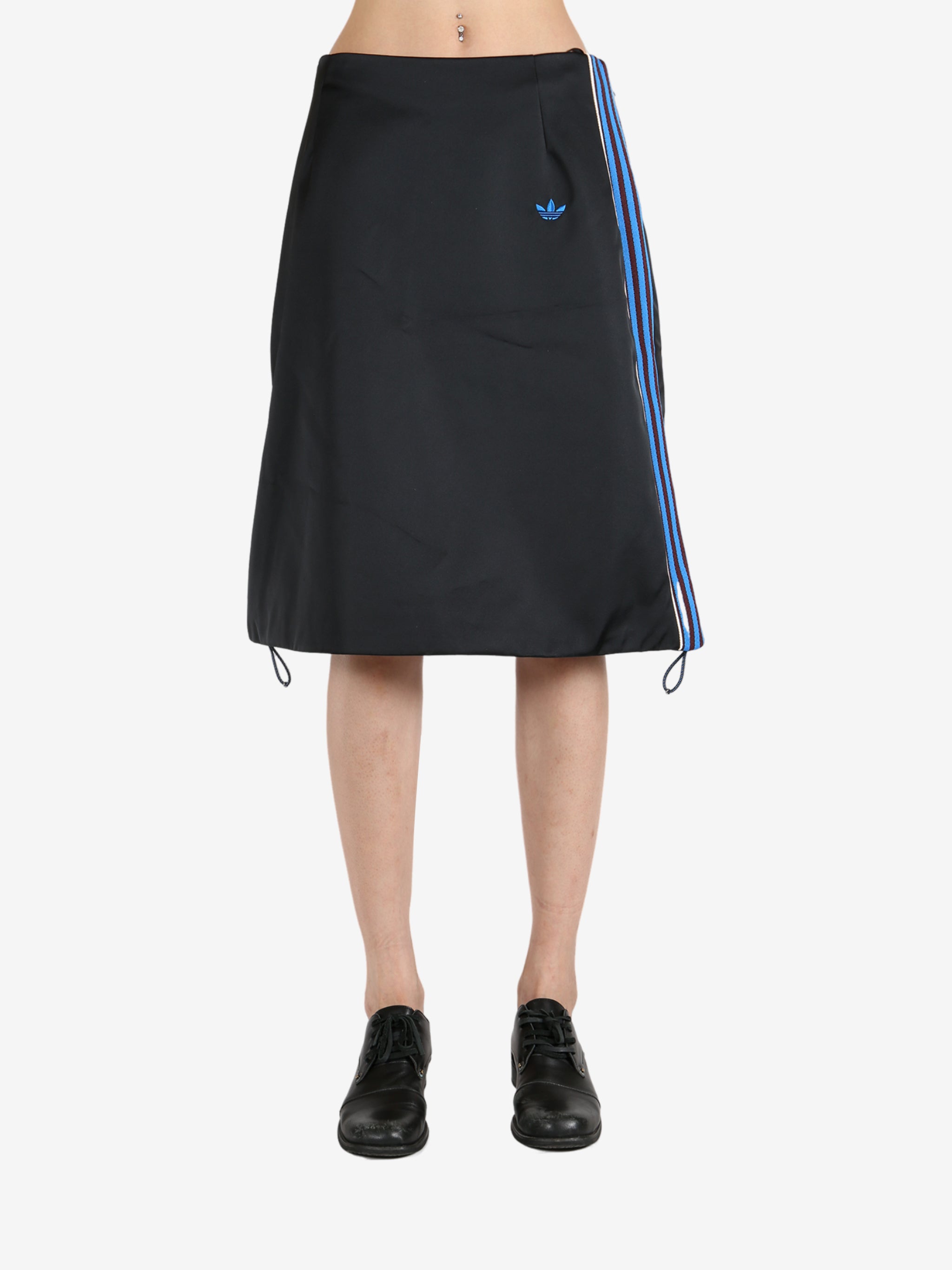 Black skirt worn by a person, showing the skirt 's fit