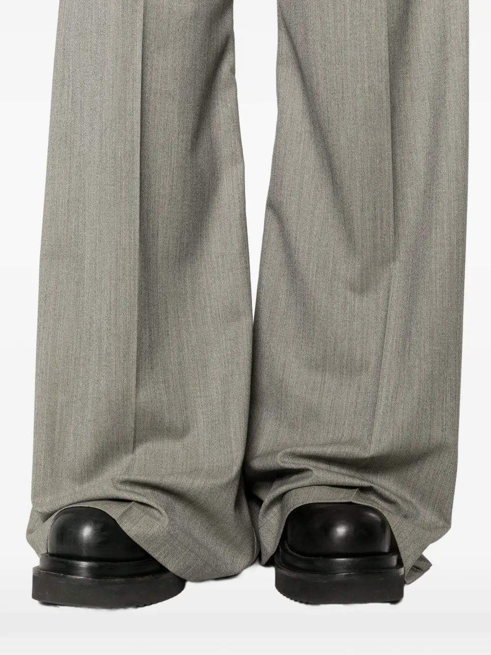 Close up of grey pant, showing texture of the virgin wool fabric