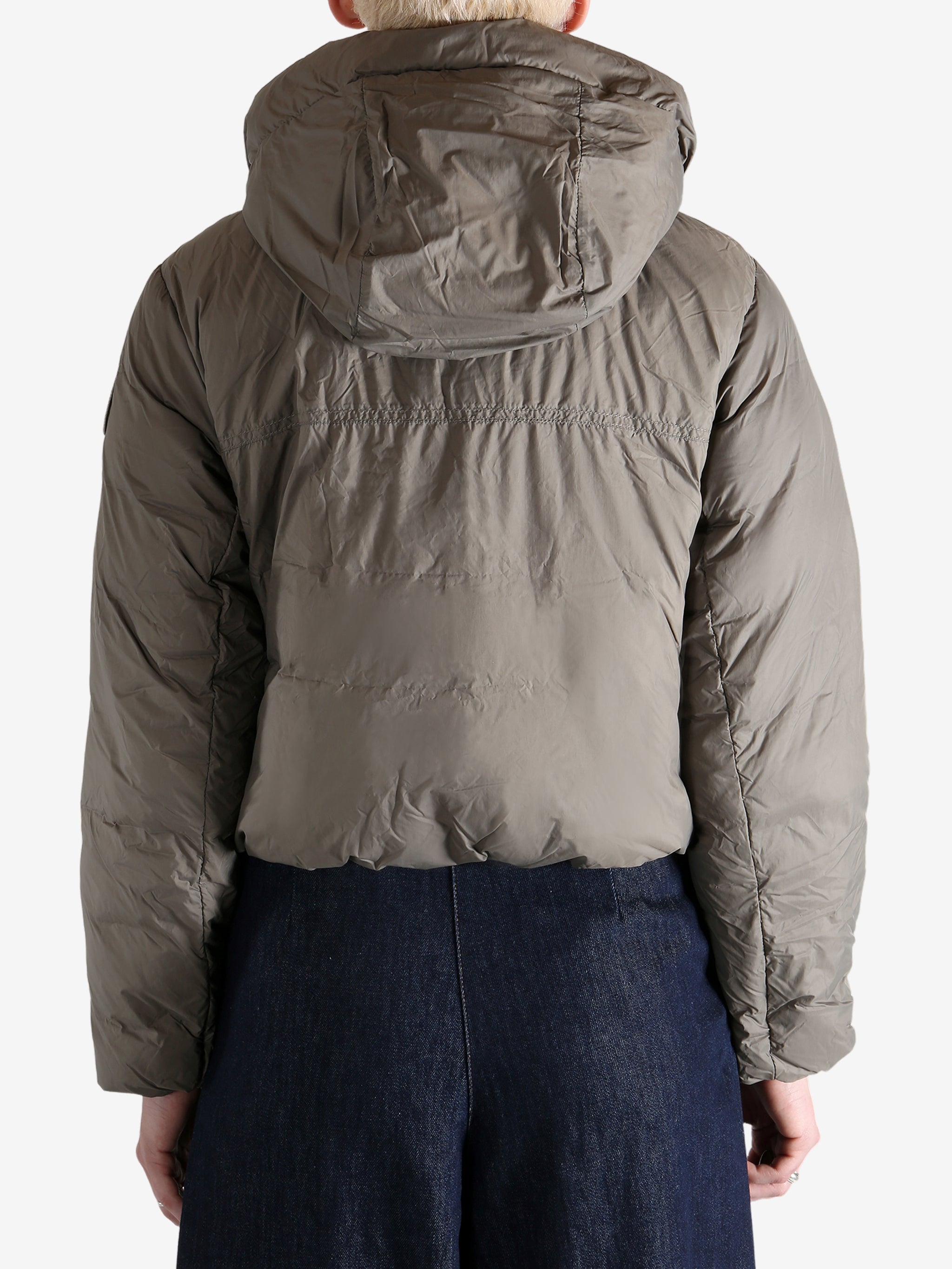 Grey jacket worn by a person, showing the jacket's fit