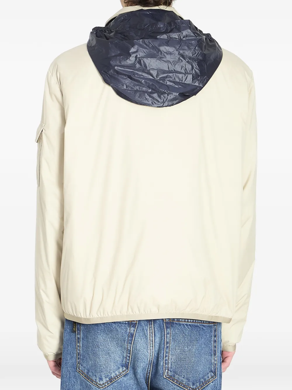 tan jacket worn by a person, showing the jacket fit