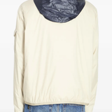 tan jacket worn by a person, showing the jacket fit