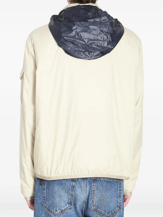 tan jacket worn by a person, showing the jacket fit