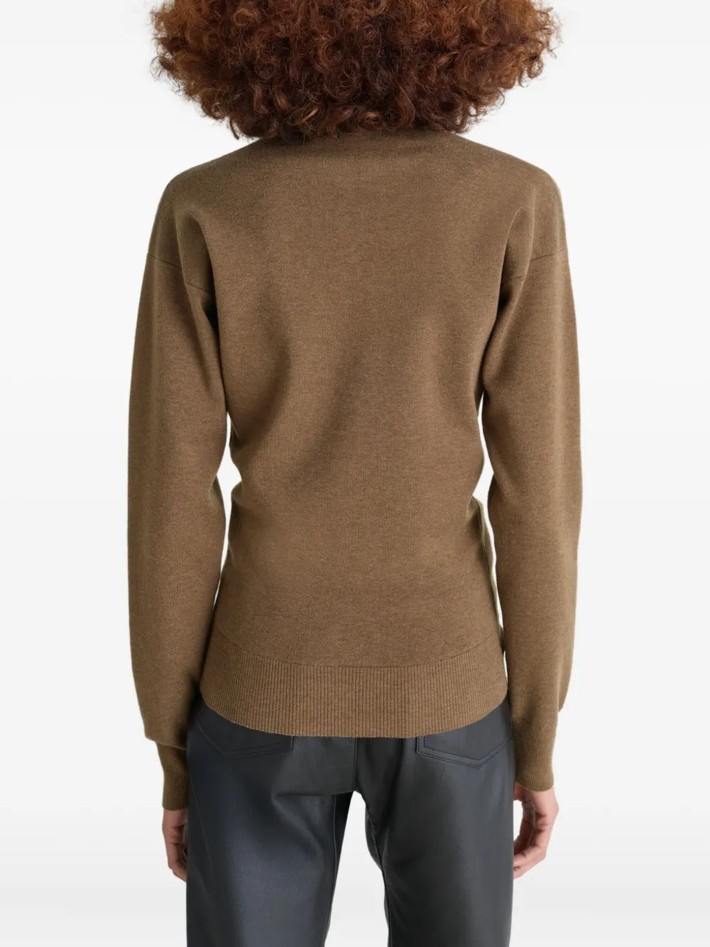 Brown knitwear worn by a person, showing the knitwear's fit